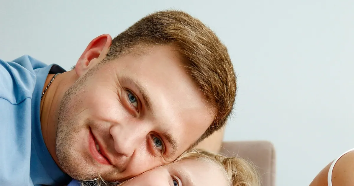 Parents and children resting their heads close together